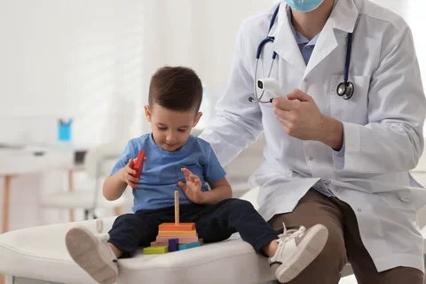 Child playing with a toy at the doctors office