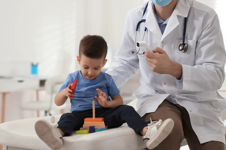 Child playing with a toy at the doctors office