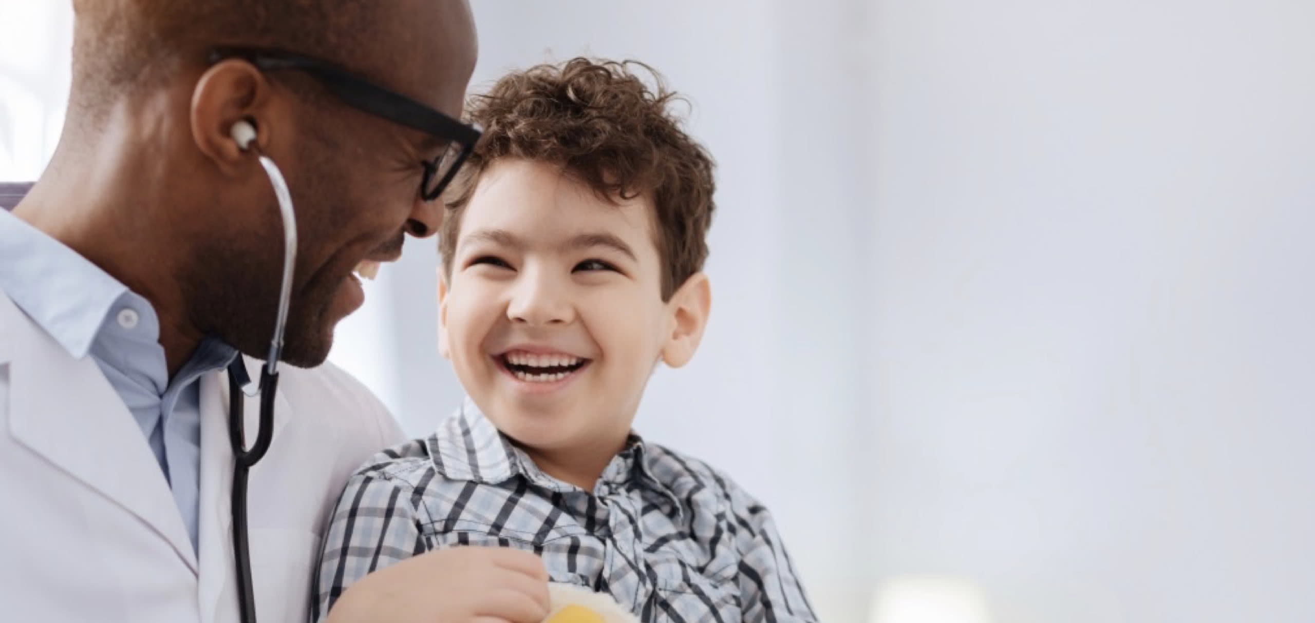 Young patient smiling with care provider.